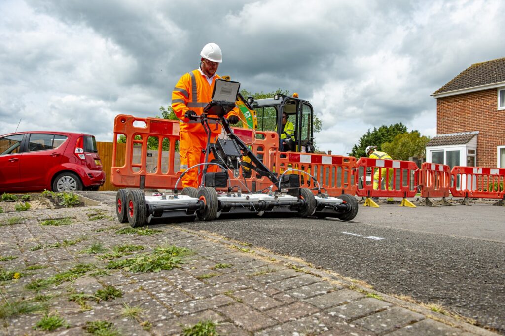 Openreach engineer using ground penetrating radar to help lay fibre cable