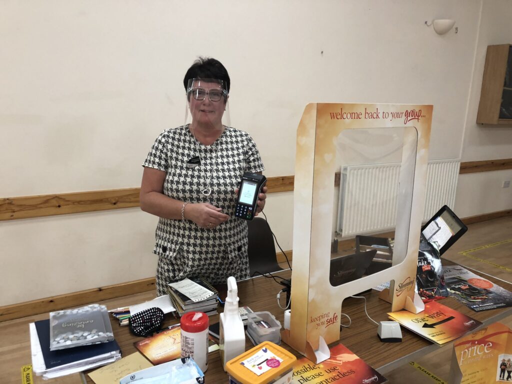 Slimming World consultant Dawn with her hand-held payment device