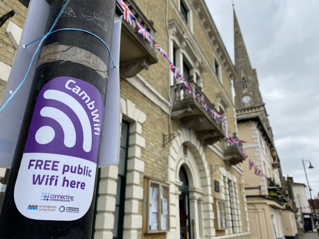 A CambWifi sticker on the lamppost outside St Ives Town Hall.