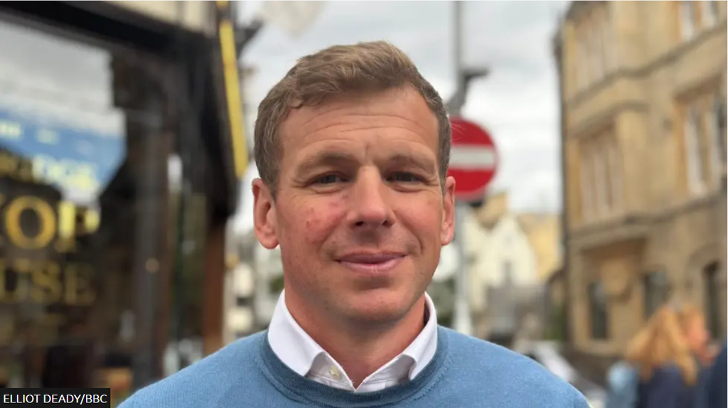 Photo of Michael Stevens standing in central Cambridge.