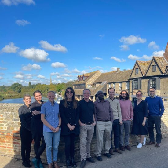 The Wiser team standing in the bridge in St Neots near their office.