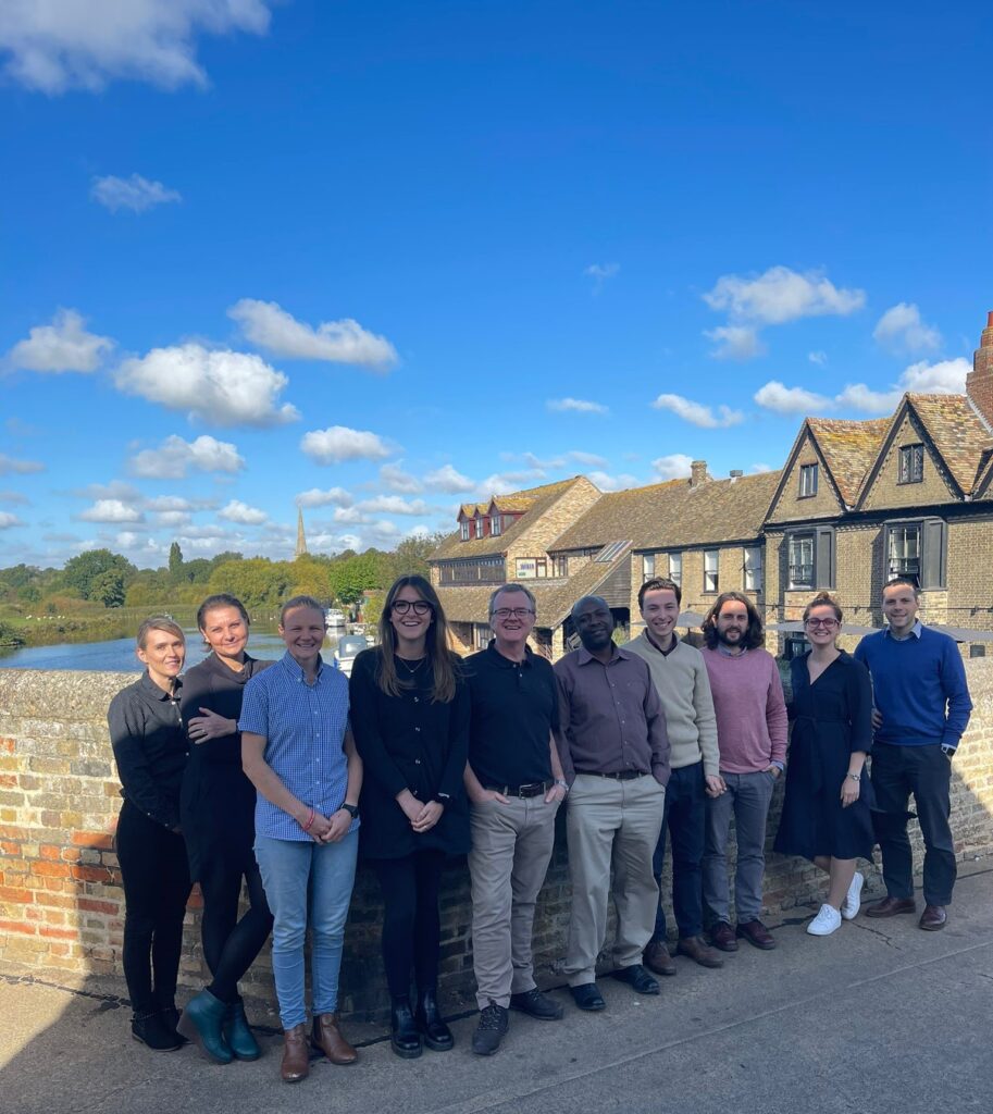 The Wiser team standing in the bridge in St Neots near their office.